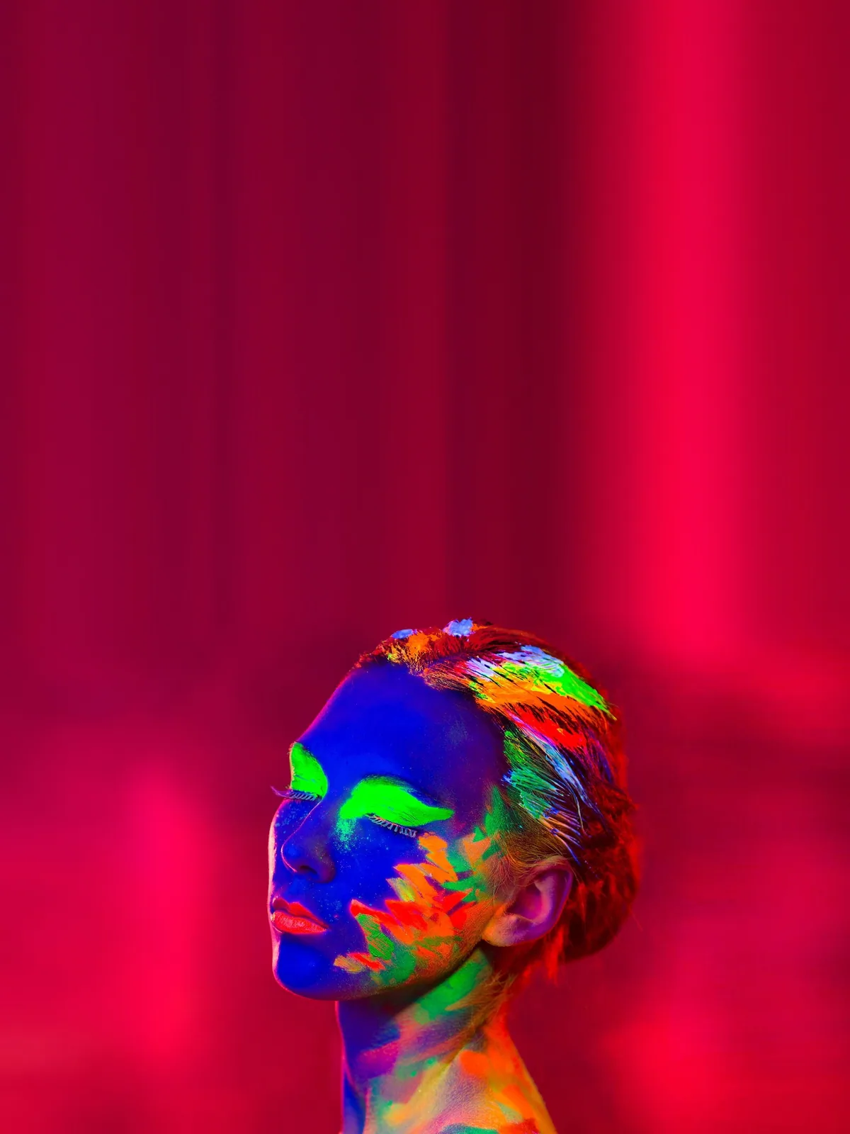 A portrait lit in saturated colour